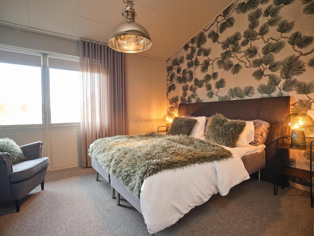 Postel nebo postele na pokoji v ubytování HAGA Hotell & Bistro