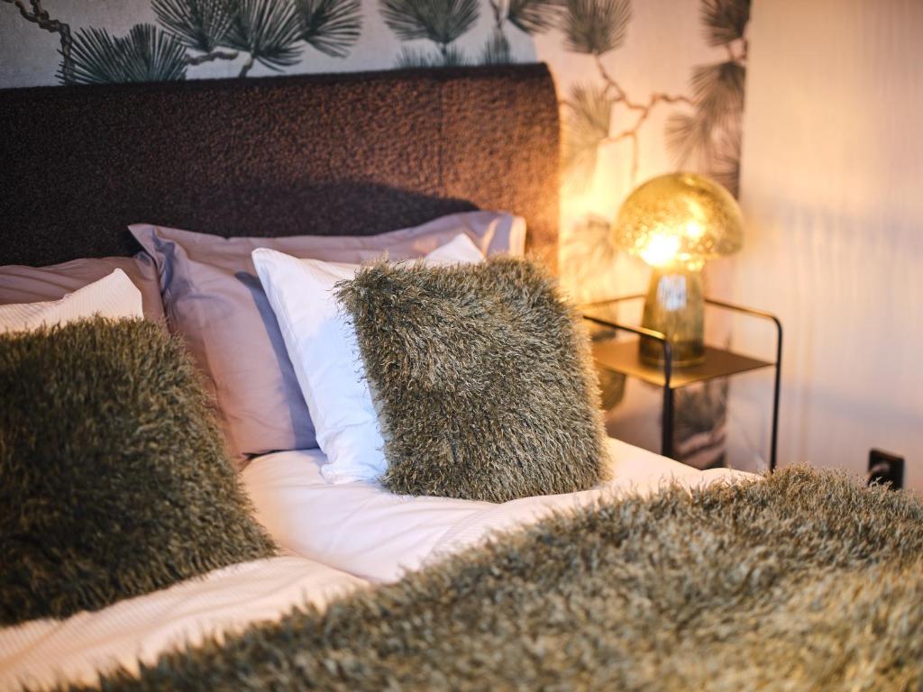 Postel nebo postele na pokoji v ubytování HAGA Hotell & Bistro