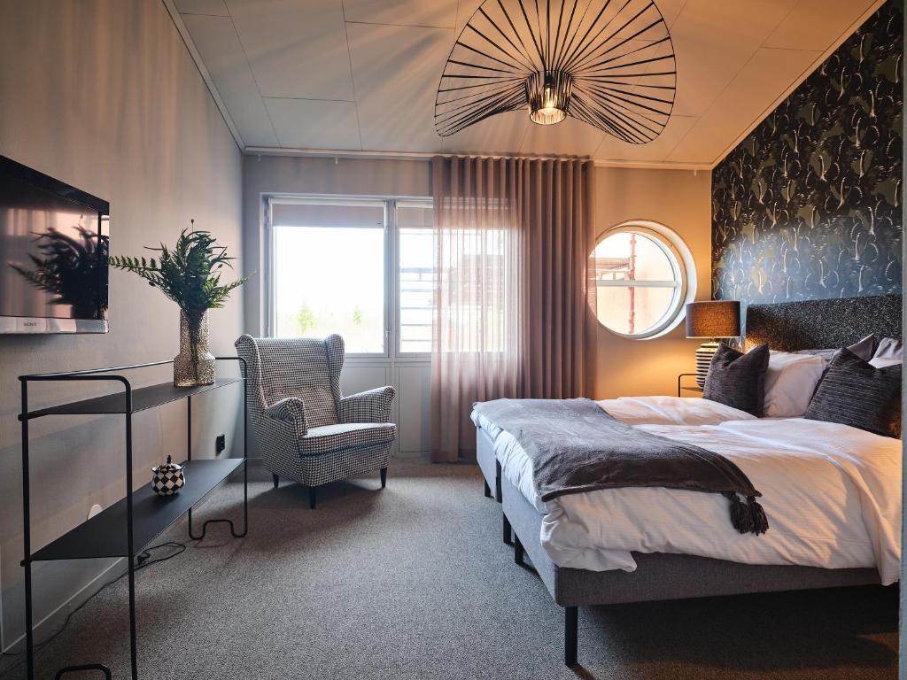 Postel nebo postele na pokoji v ubytování HAGA Hotell & Bistro