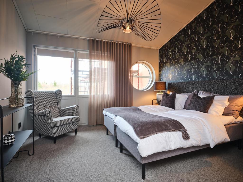 Postel nebo postele na pokoji v ubytování HAGA Hotell & Bistro