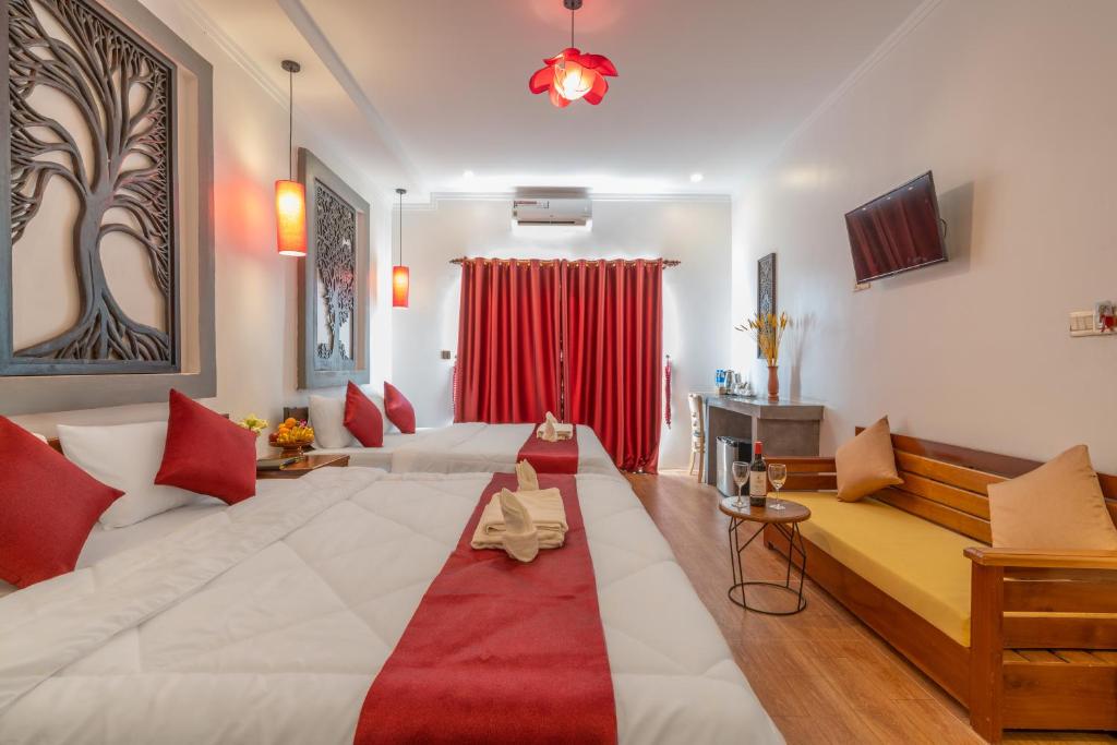 Postel nebo postele na pokoji v ubytování Angkor Rithy Residence