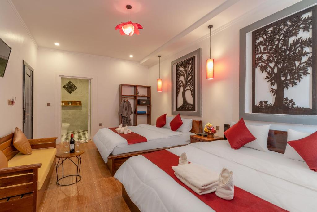 Postel nebo postele na pokoji v ubytování Angkor Rithy Residence