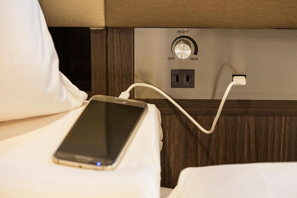 Postel nebo postele na pokoji v ubytování HOTEL MYSTAYS Ueno East