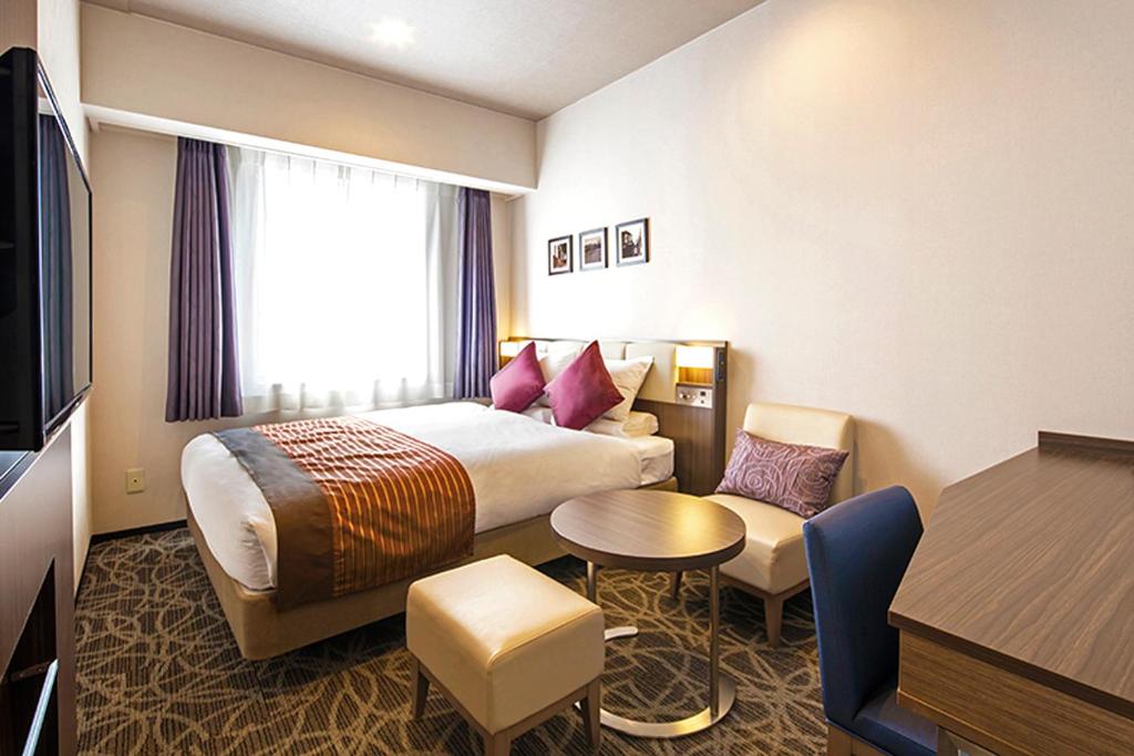 Postel nebo postele na pokoji v ubytování HOTEL MYSTAYS Ueno East
