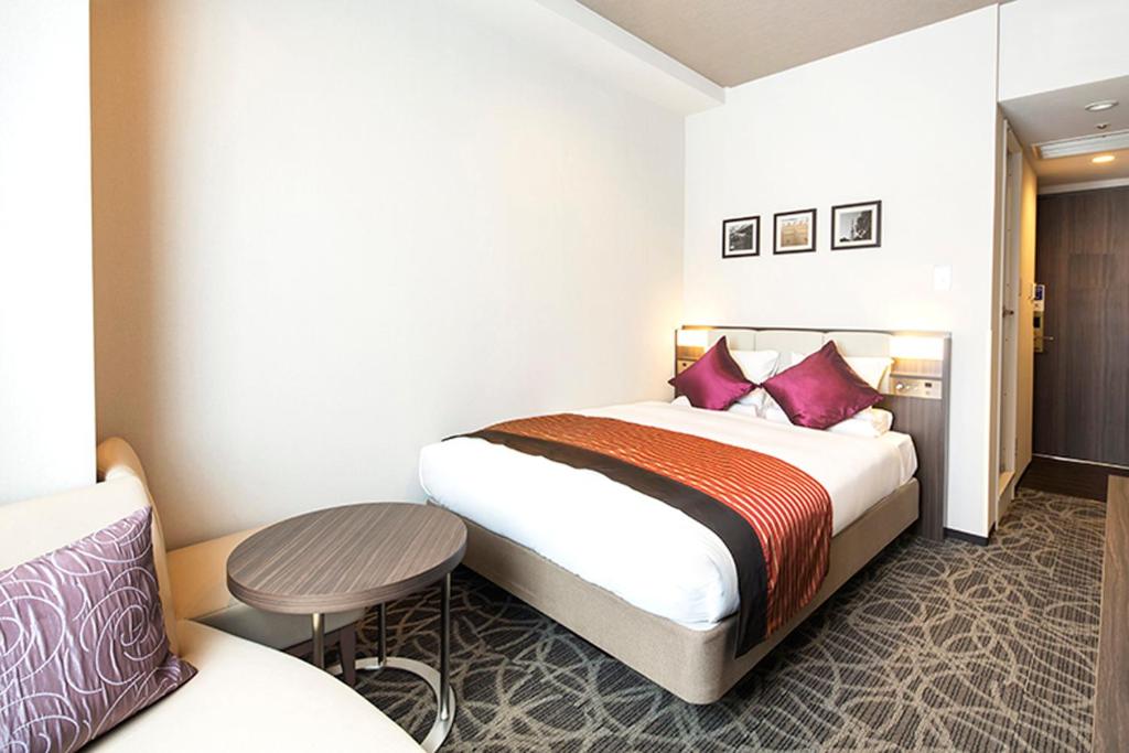 Postel nebo postele na pokoji v ubytování HOTEL MYSTAYS Ueno East