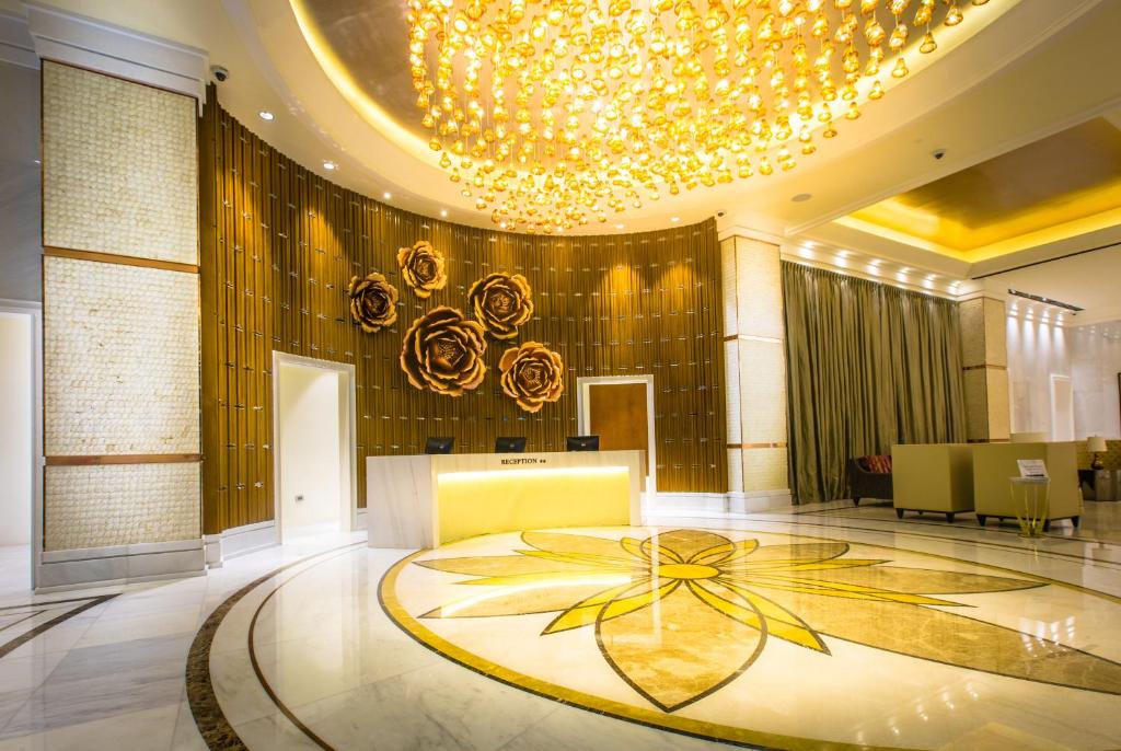 a lobby with a large mandala on the floor at Winford Resort and Casino Manila in Manila