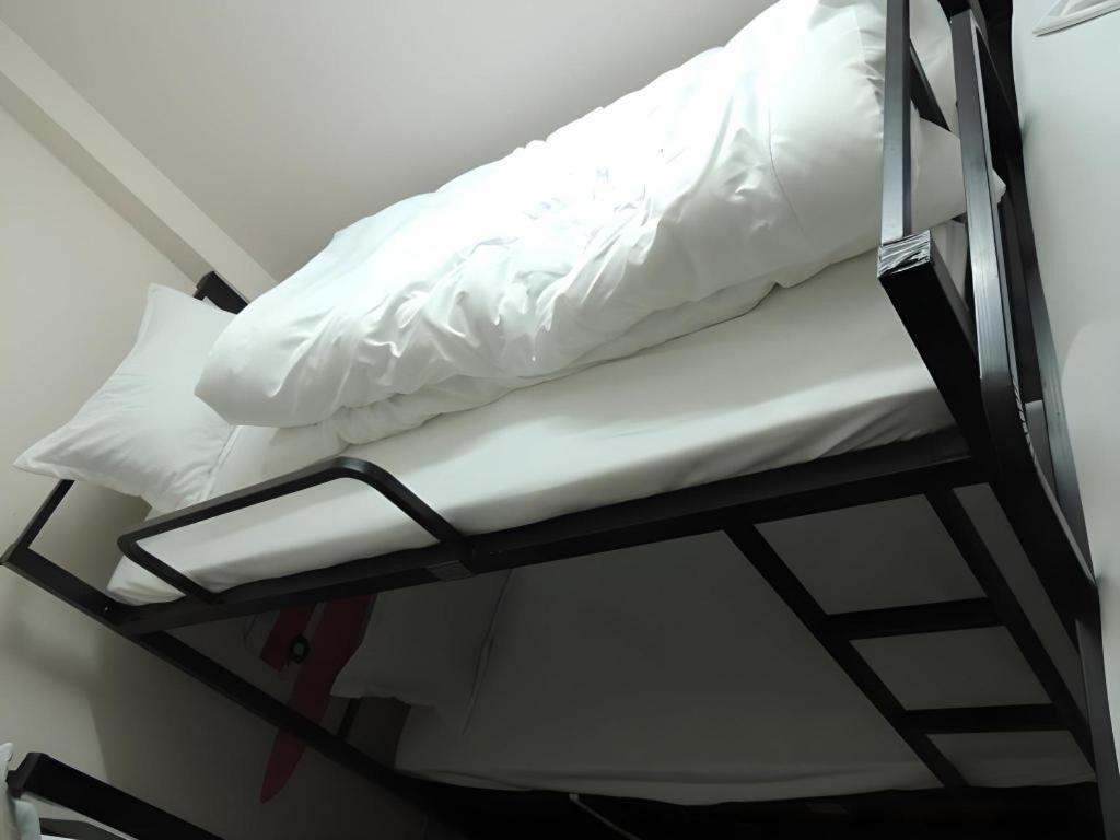 Postel nebo postele na pokoji v ubytování Halong Happy Hostel