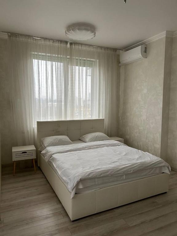 Postel nebo postele na pokoji v ubytování Apart Assistant on Smart Plaza