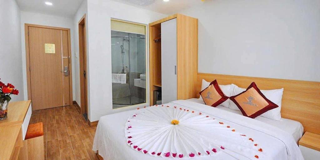 Postel nebo postele na pokoji v ubytování Sophia Sky Hotel