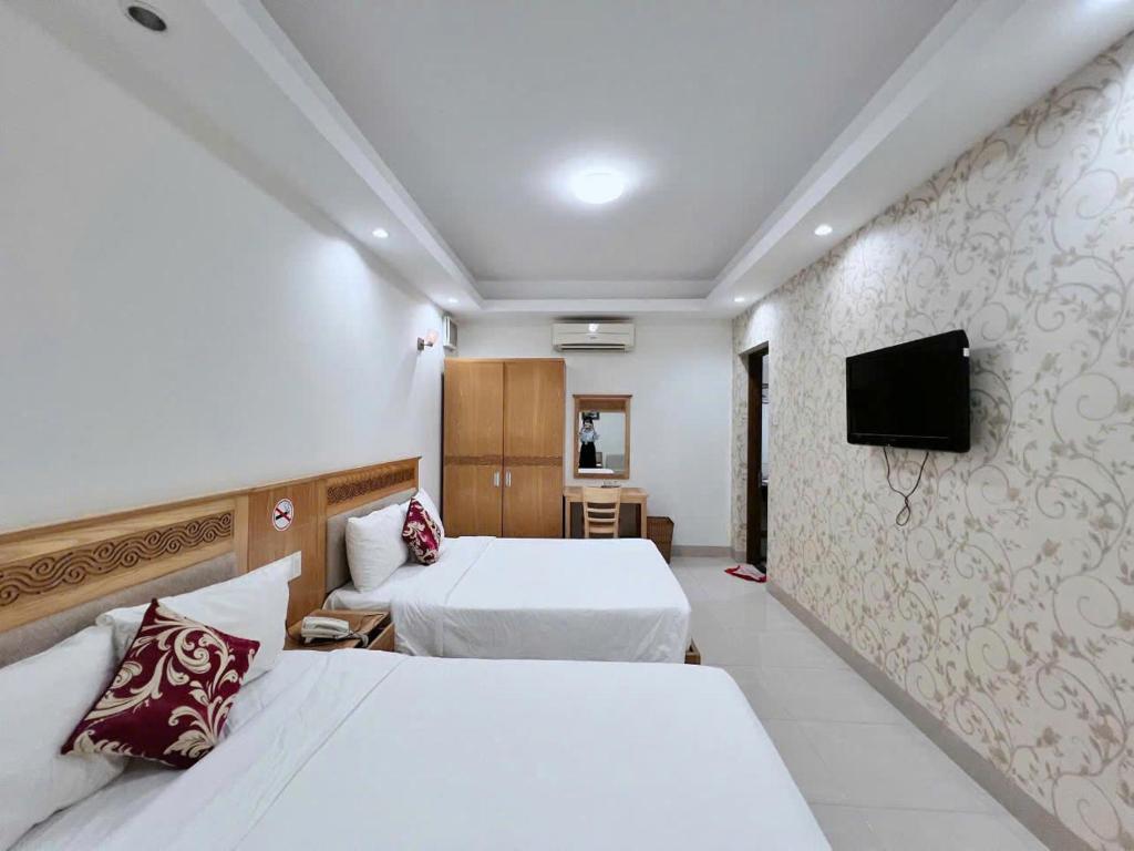 Postel nebo postele na pokoji v ubytování Sophia Sky Hotel