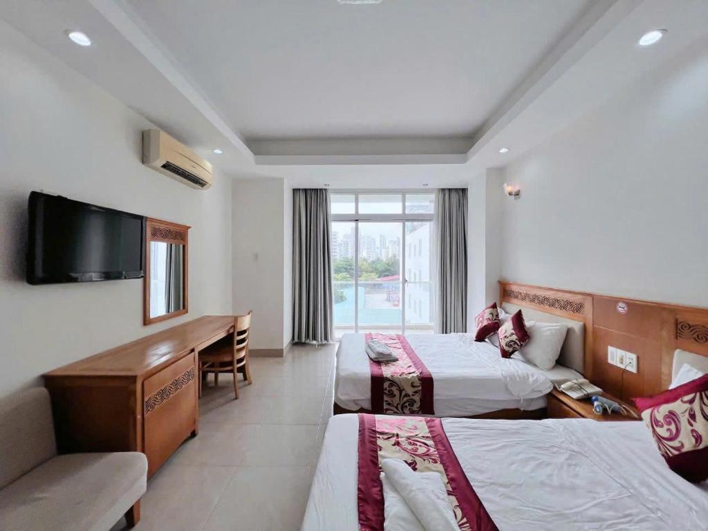 Postel nebo postele na pokoji v ubytování Sophia Sky Hotel