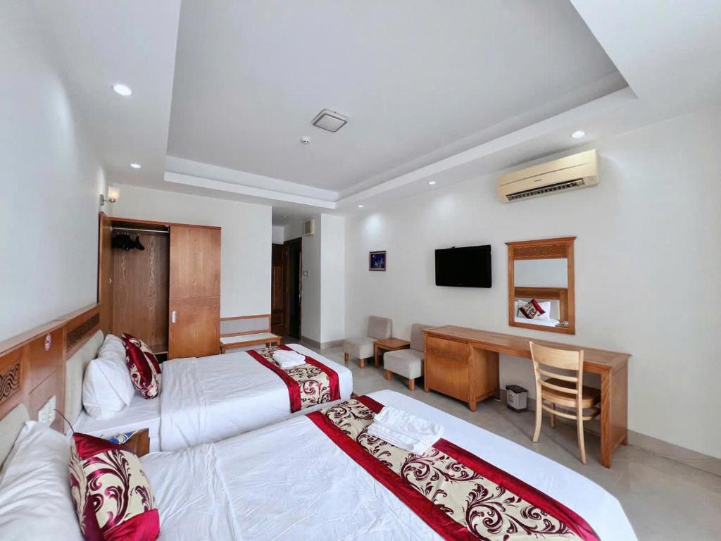 Postel nebo postele na pokoji v ubytování Sophia Sky Hotel