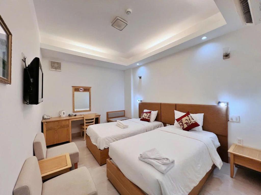Postel nebo postele na pokoji v ubytování Sophia Sky Hotel
