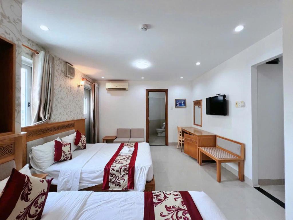 Postel nebo postele na pokoji v ubytování Sophia Sky Hotel