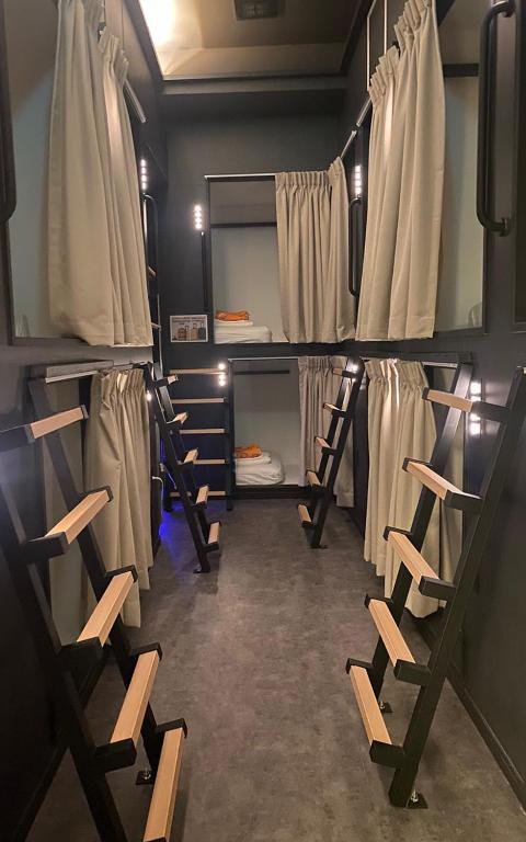 a room with a bunch of bunk beds at guest house B in Osaka