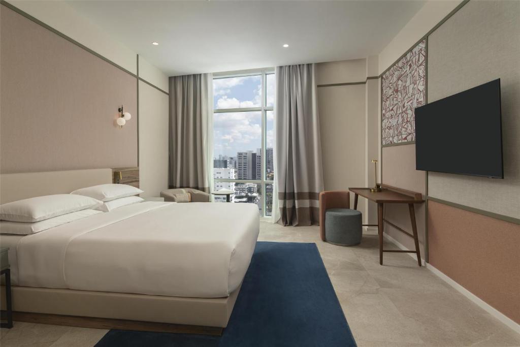 Postel nebo postele na pokoji v ubytování Hyatt Centric Santo Domingo