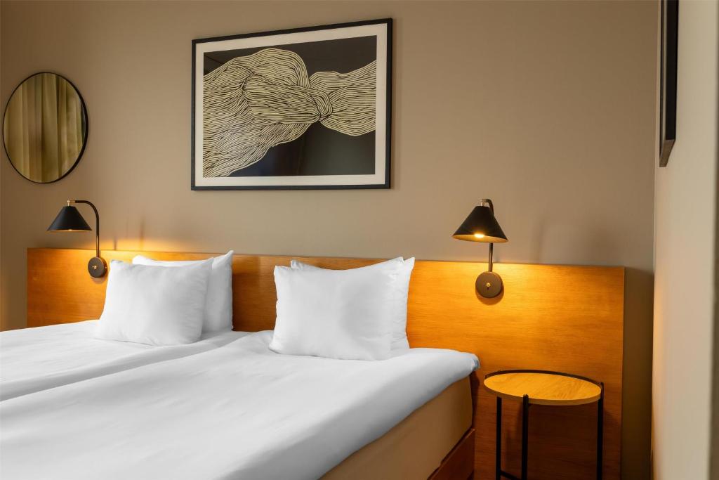 Postel nebo postele na pokoji v ubytování Hyatt Place Gothenburg Central