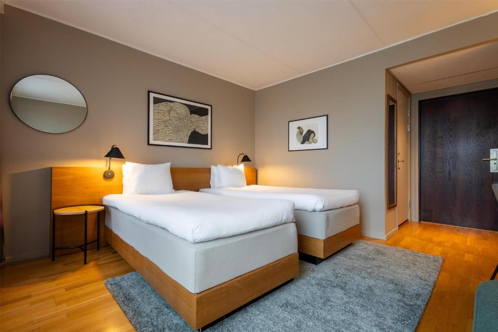 Postel nebo postele na pokoji v ubytování Hyatt Place Gothenburg Central