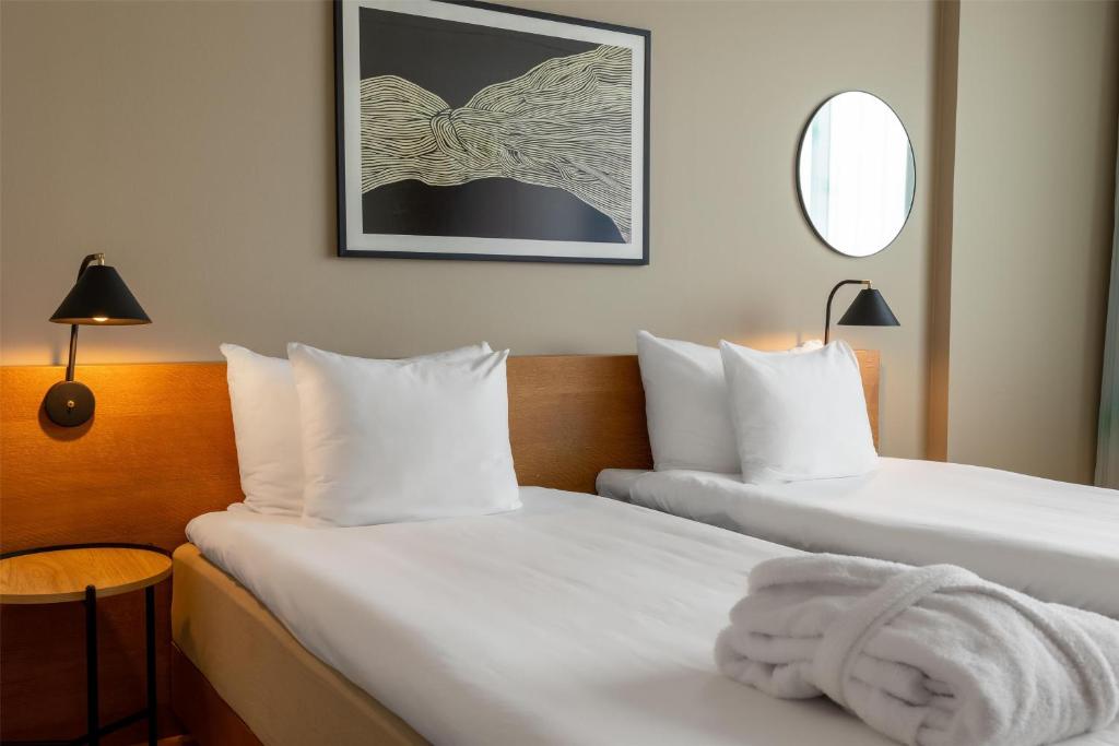 Postel nebo postele na pokoji v ubytování Hyatt Place Gothenburg Central