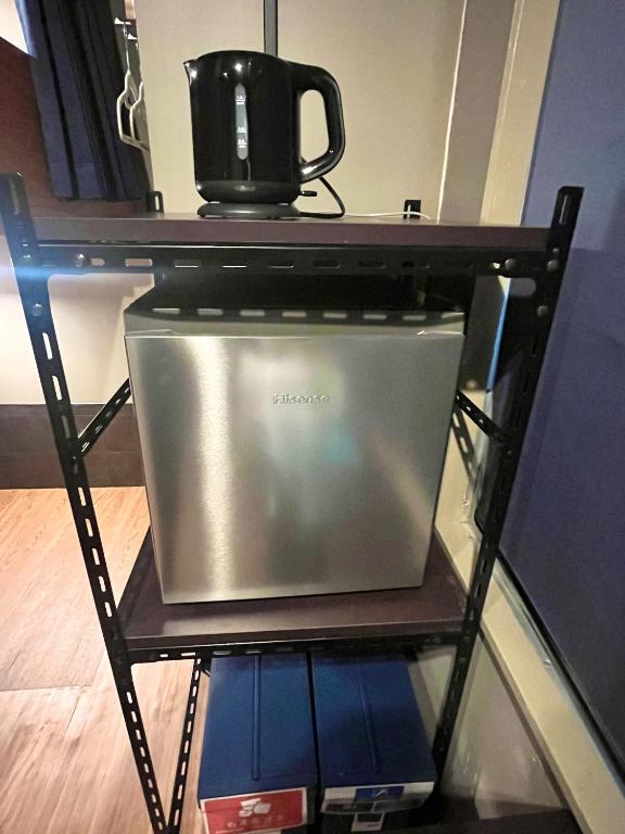 Kuchyň nebo kuchyňský kout v ubytování Wasabi Mita Hotel