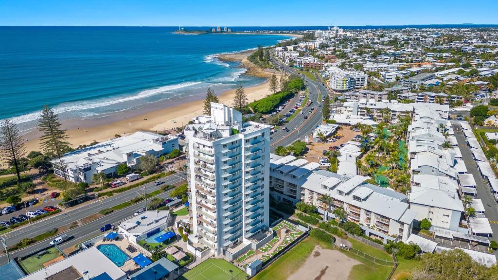 an aerial view of a beach and buildings at Mandolin Beachfront Resort in Alexandra Headland