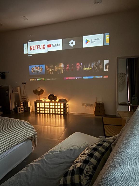 a bedroom with a bed and a sign on the wall at Casa Boheme Empire Damansara in Petaling Jaya