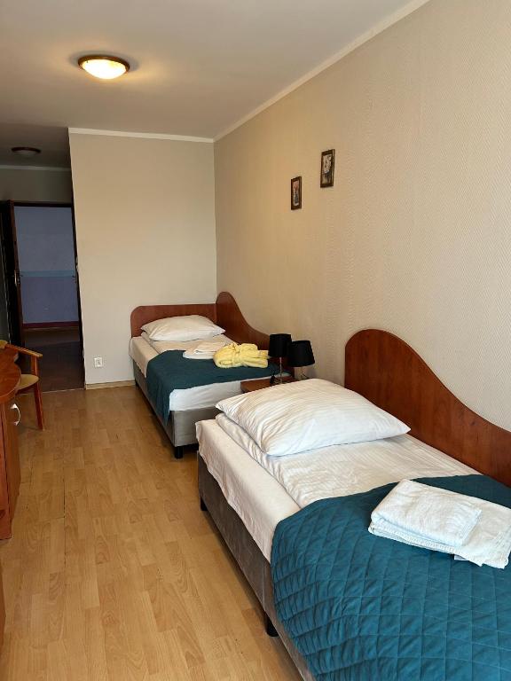 Postel nebo postele na pokoji v ubytování Sanatorium Fala