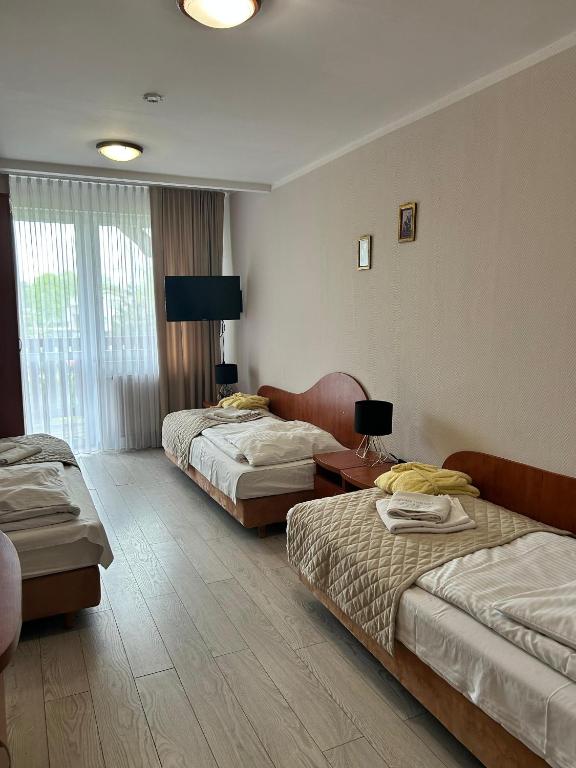 Postel nebo postele na pokoji v ubytování Sanatorium Fala