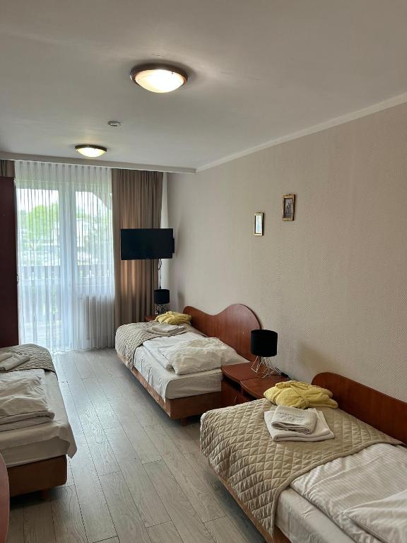 Postel nebo postele na pokoji v ubytování Sanatorium Fala