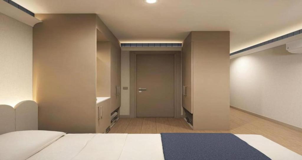 Postel nebo postele na pokoji v ubytování EL DE Olive Aero Suites Near Delhi Airport