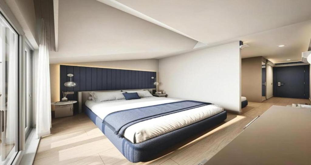 Postel nebo postele na pokoji v ubytování EL DE Olive Aero Suites Near Delhi Airport