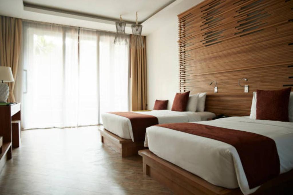 Postel nebo postele na pokoji v ubytování EL DE Olive Aero Suites Near Delhi Airport