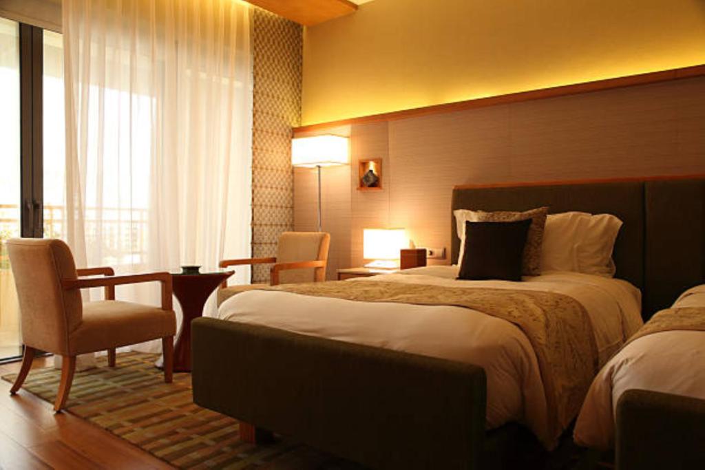 Postel nebo postele na pokoji v ubytování EL DE Olive Aero Suites Near Delhi Airport