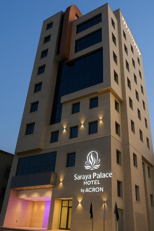 un edificio con un cartello di fronte di Saraya Palace Hotel a Doha