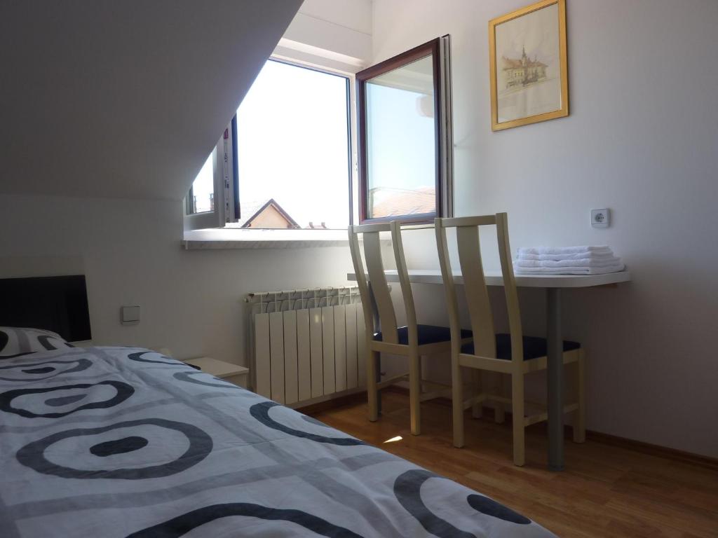 Postel nebo postele na pokoji v ubytování Rooms & Apartment Mira G.