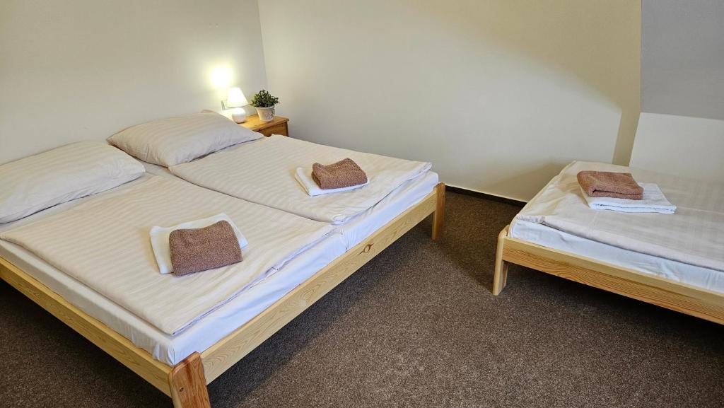 Postel nebo postele na pokoji v ubytování Baurů Dvůr