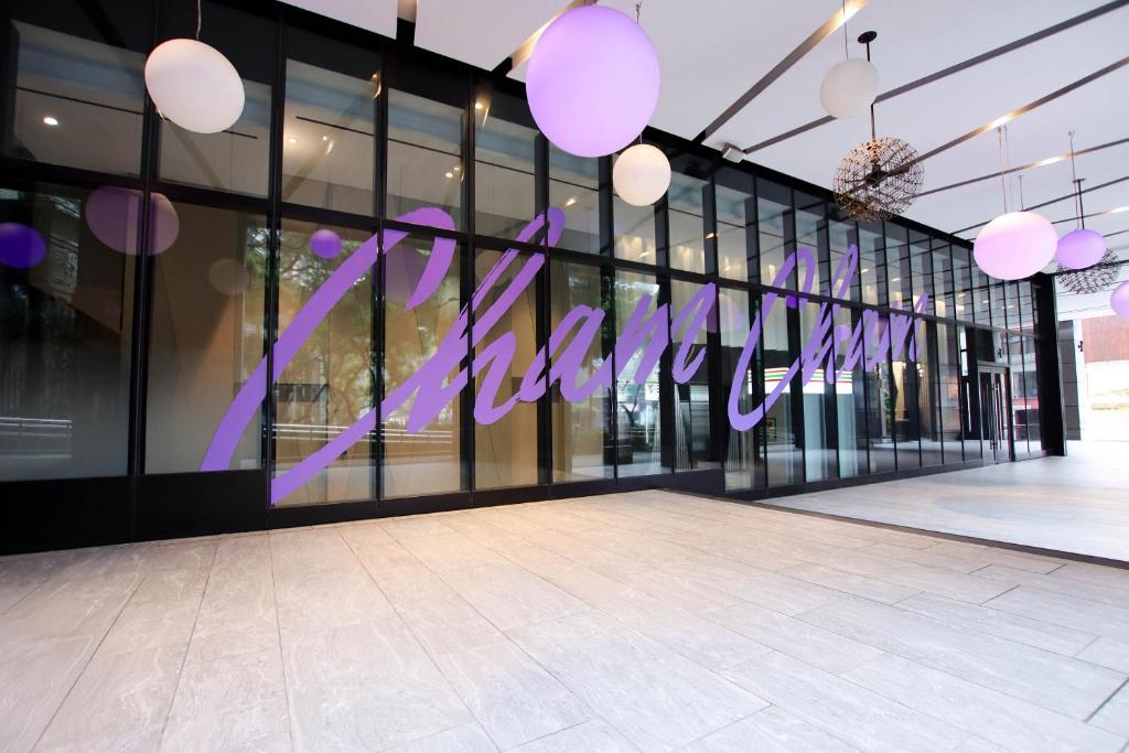 a store front with purple letters on the windows at HOTEL CHAM CHAM - Taipei in Taipei