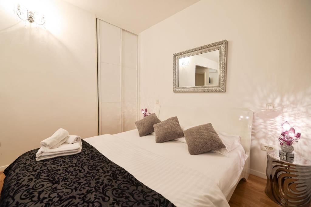 Posteľ alebo postele v izbe v ubytovaní Tinel Superior Residence