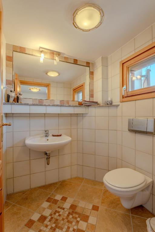 a bathroom with a toilet and a sink at Villa Sternfalle with jacuzzi by 8essentially in Elaía
