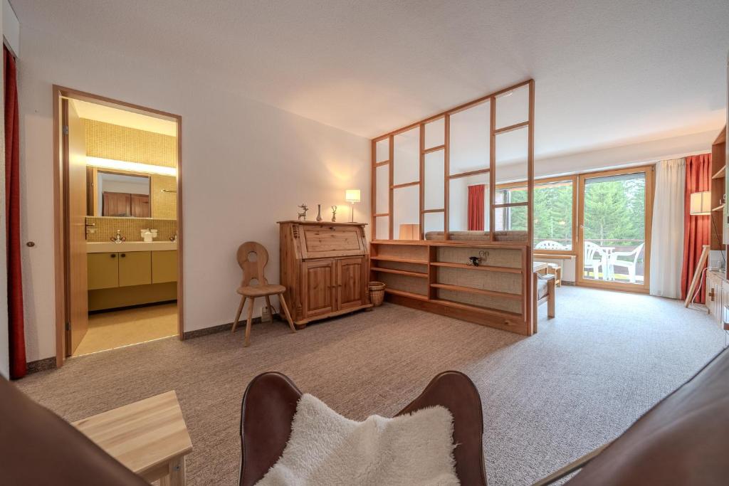 Postel nebo postele na pokoji v ubytování Rehwiesa A11 by Arosa Vacations