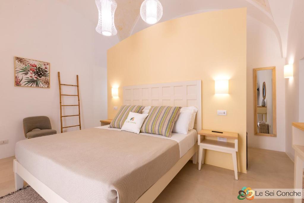Łóżko lub łóżka w pokoju w obiekcie Le Sei Conche Relais & SPA