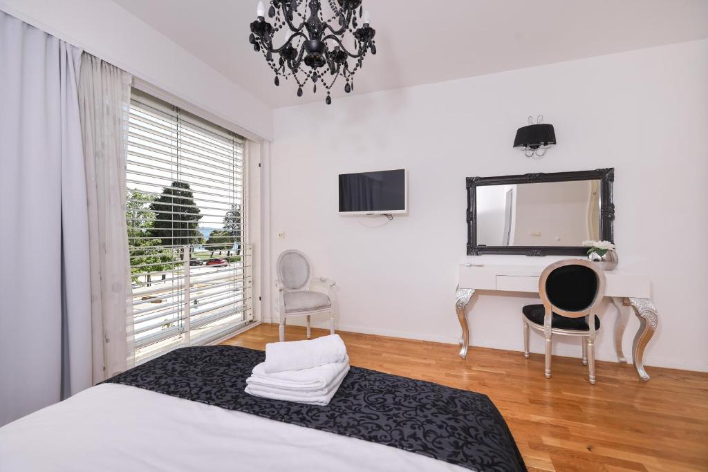 Posteľ alebo postele v izbe v ubytovaní Tinel Superior Residence