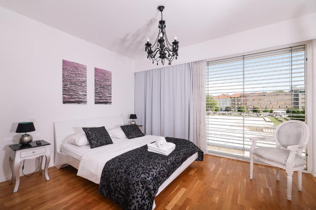 Posteľ alebo postele v izbe v ubytovaní Tinel Superior Residence