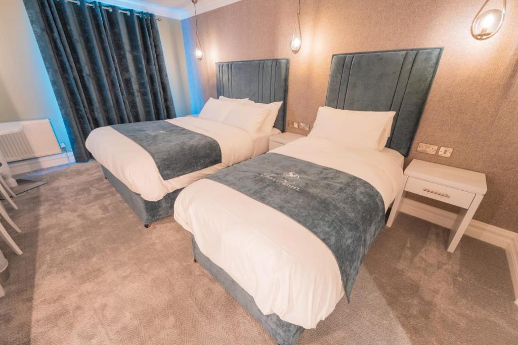 Postel nebo postele na pokoji v ubytování Tara Hotel