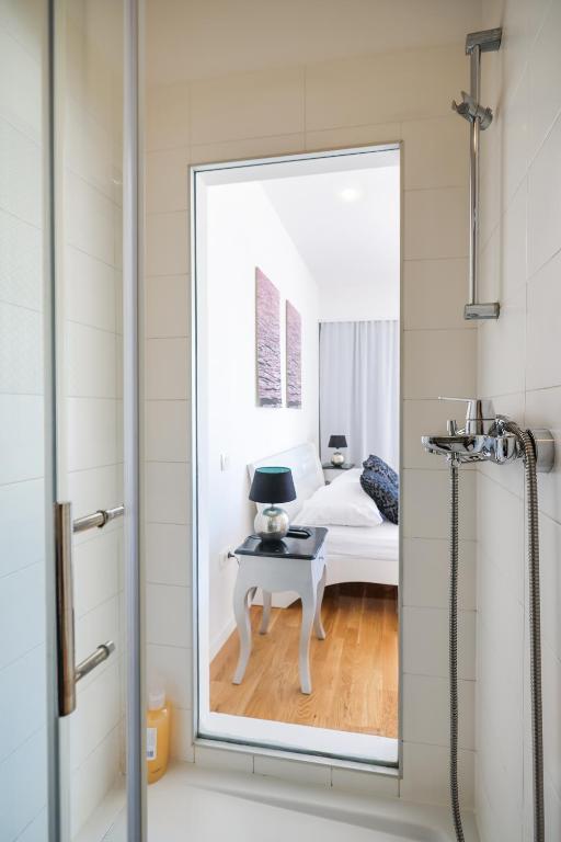 Posteľ alebo postele v izbe v ubytovaní Tinel Superior Residence