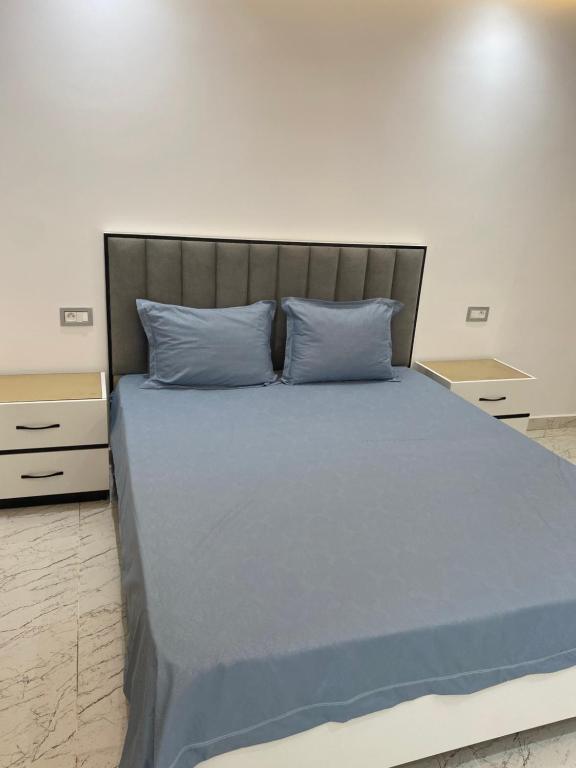Postel nebo postele na pokoji v ubytování Duplex El mansoura A0