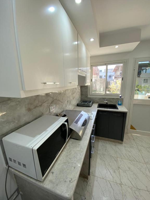 Kuchyň nebo kuchyňský kout v ubytování Duplex El mansoura A0
