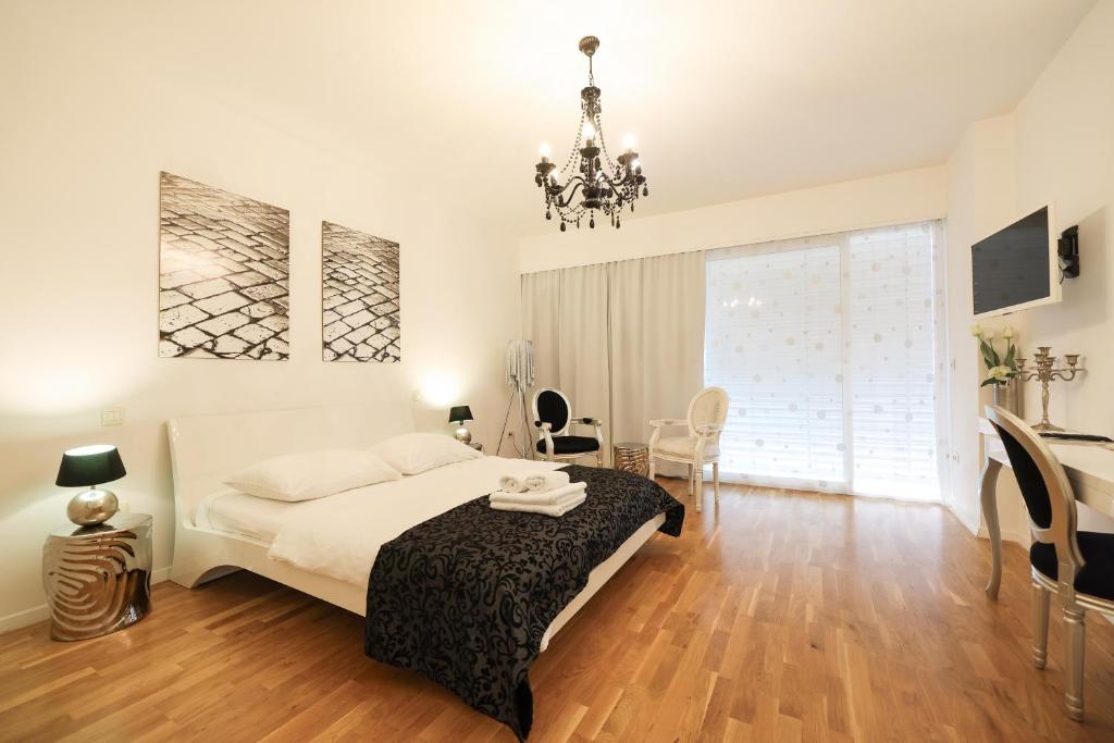 Posteľ alebo postele v izbe v ubytovaní Tinel Superior Residence