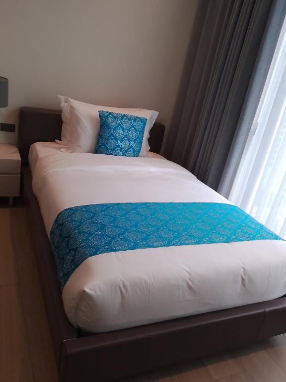 Postel nebo postele na pokoji v ubytování Bayprime Hotel