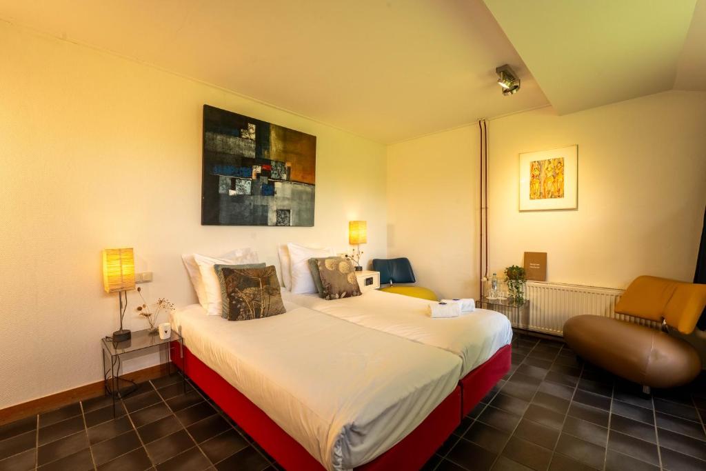 Postel nebo postele na pokoji v ubytování Hotel & Restaurant Weidumerhout